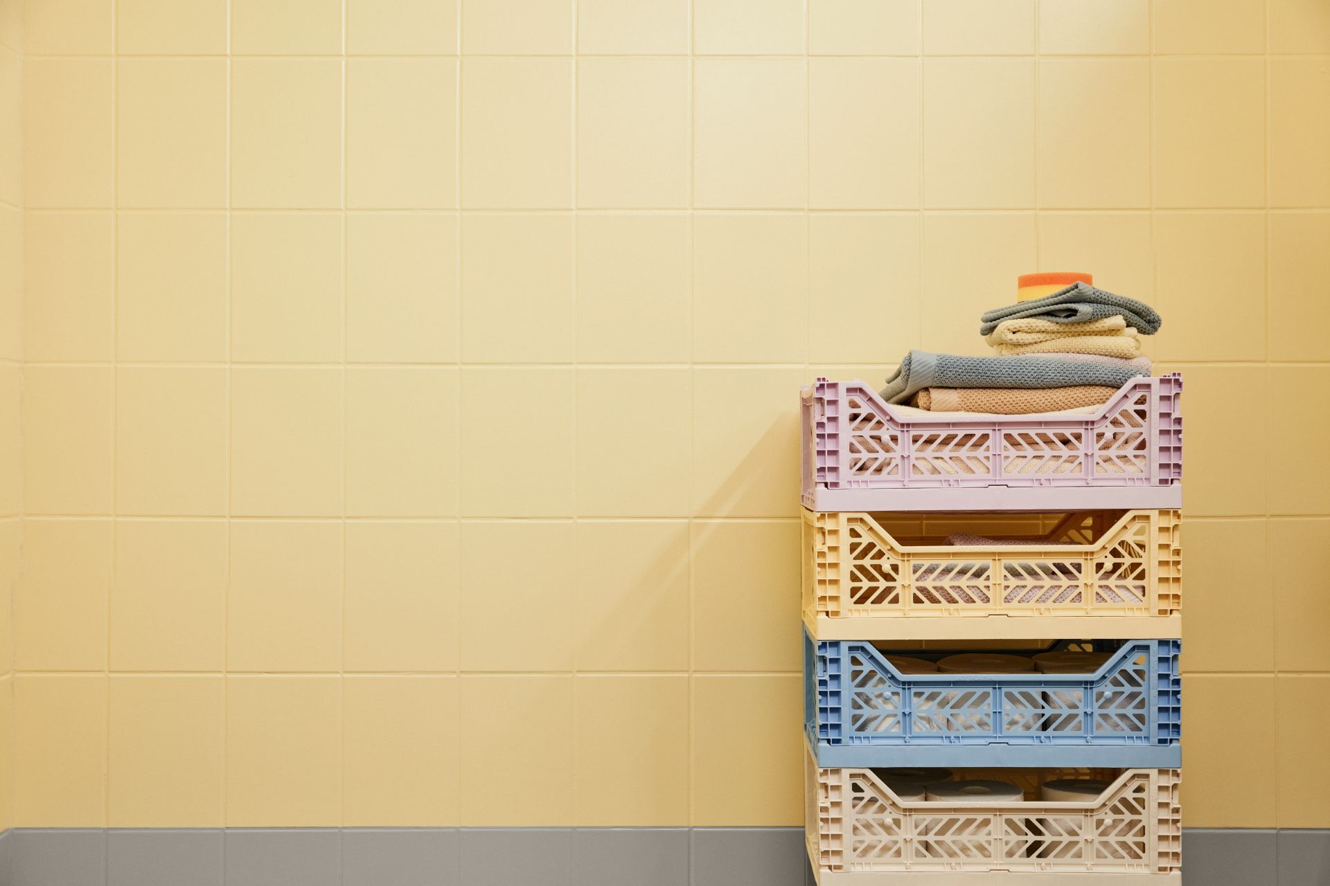 bathroom tiles painted in bright yellow and grey colour