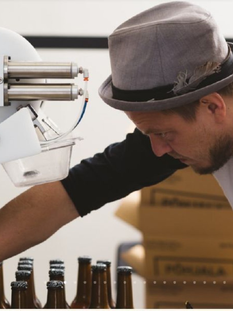 Põhjala Brewery man with beer bottles 
