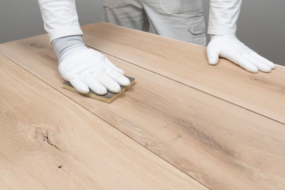 sanding wooden surface