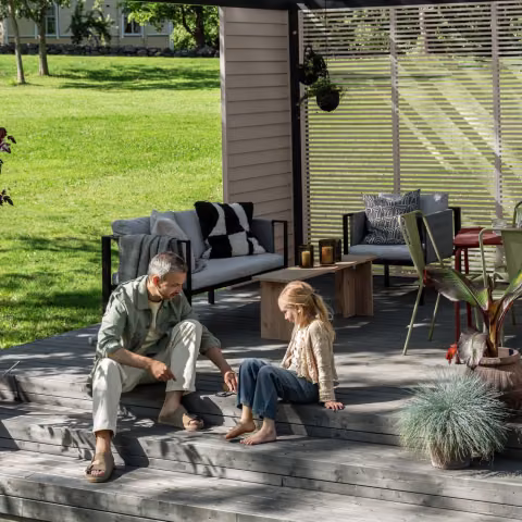 enjoying newly painted wooden decking