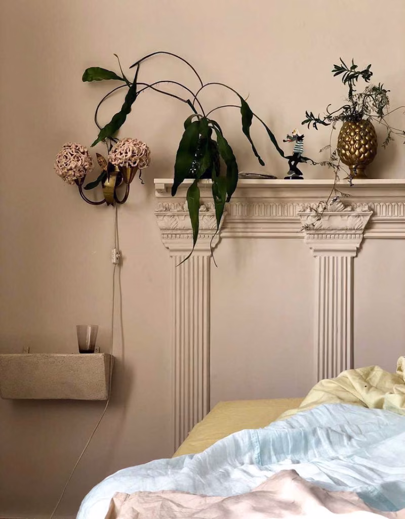 beige in wall colour and bed headboard